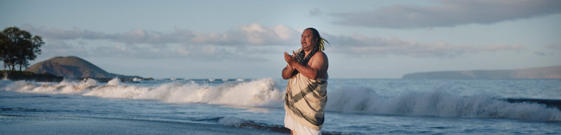man standing in the ocean