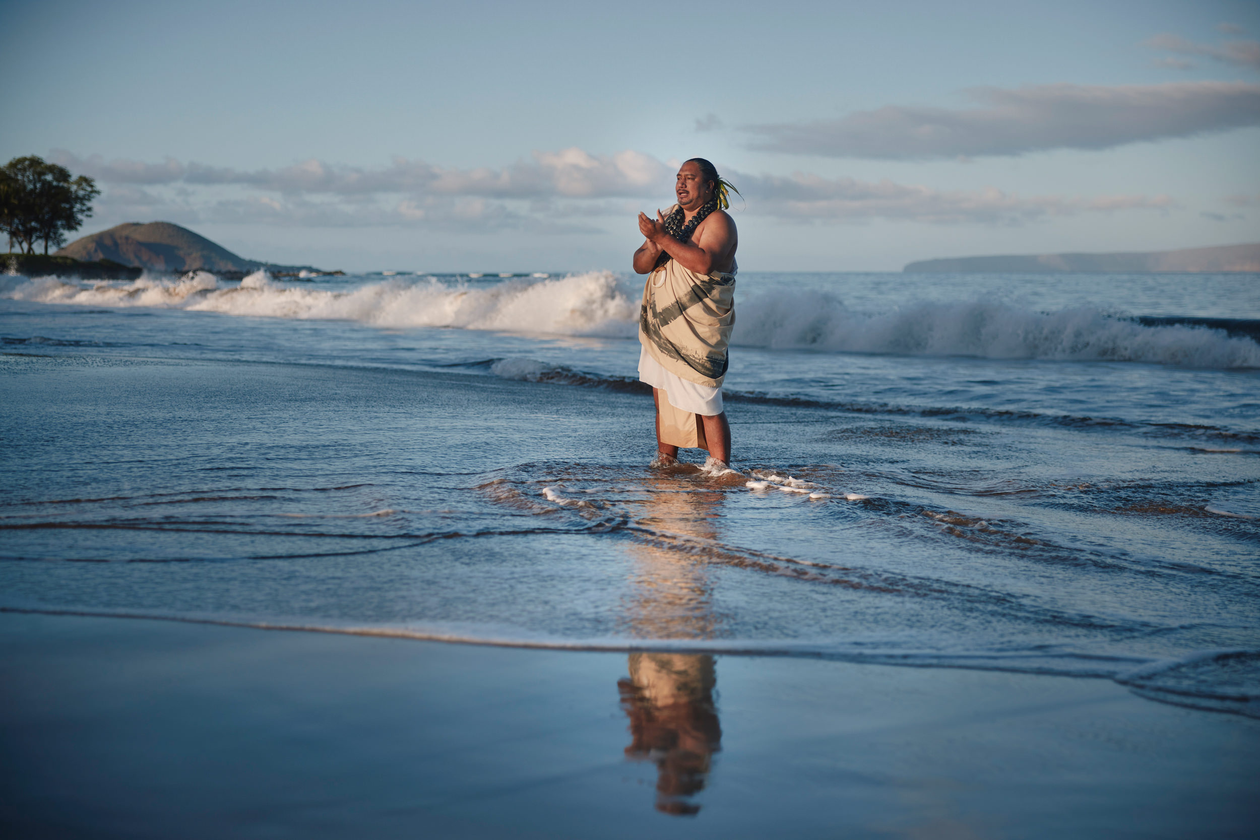 man standing in the ocean