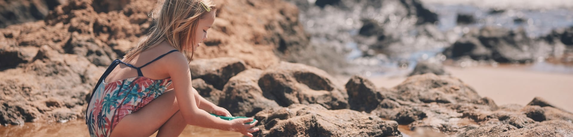 little girl playing in the sand