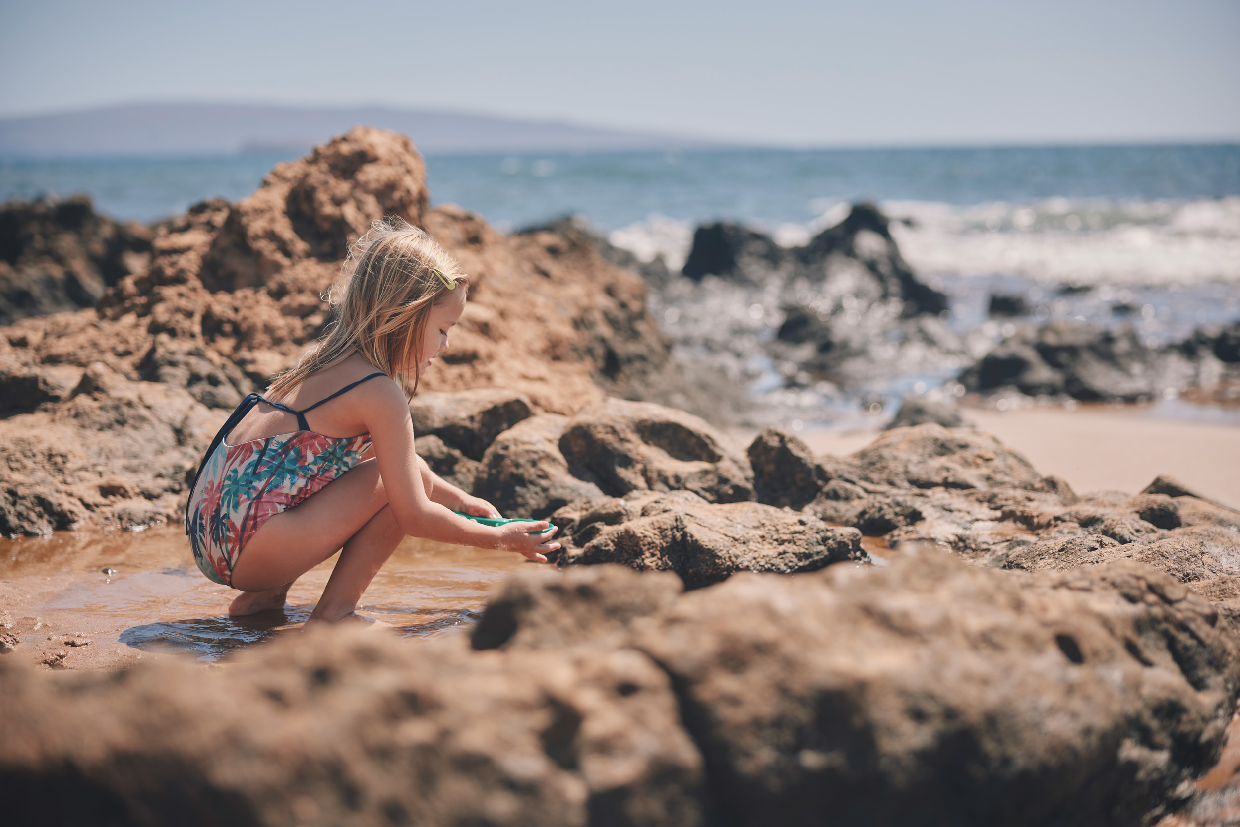 little girl playing in the sand
