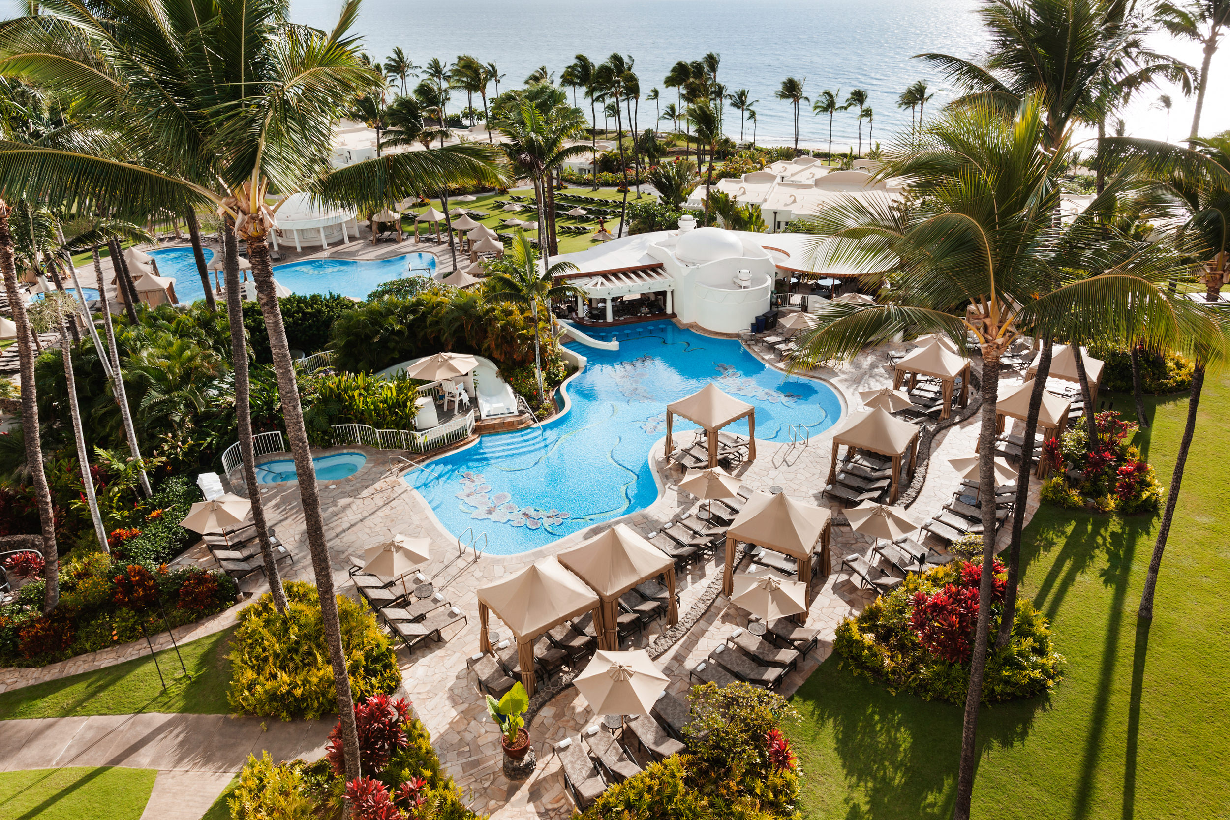 areal shot of two pools connected by a water slide