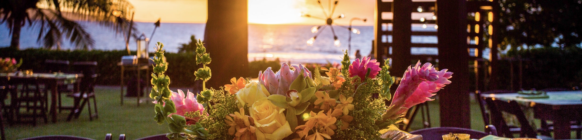 table set up with floral center piece and hints of green