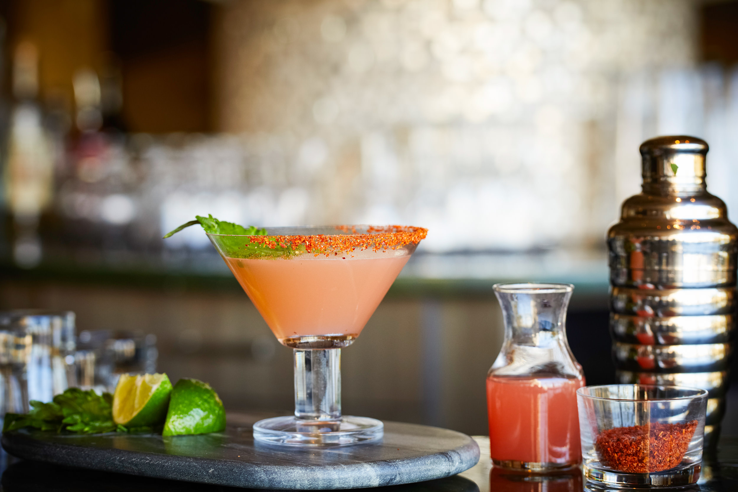 pink cocktail with spice on the rim