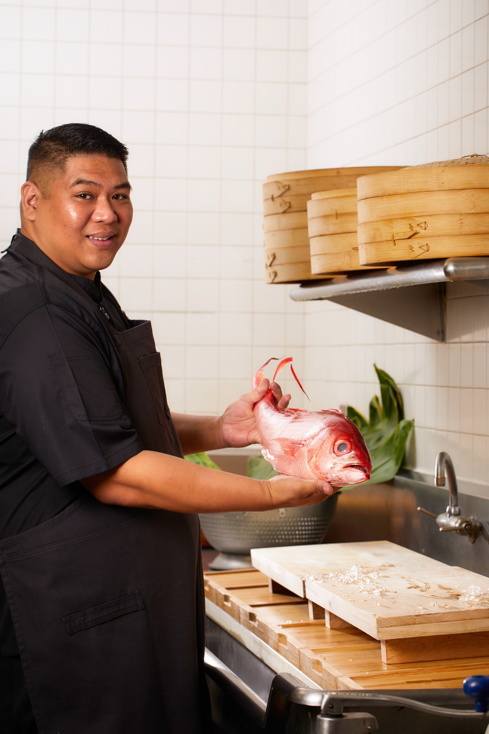 chef holding a fish