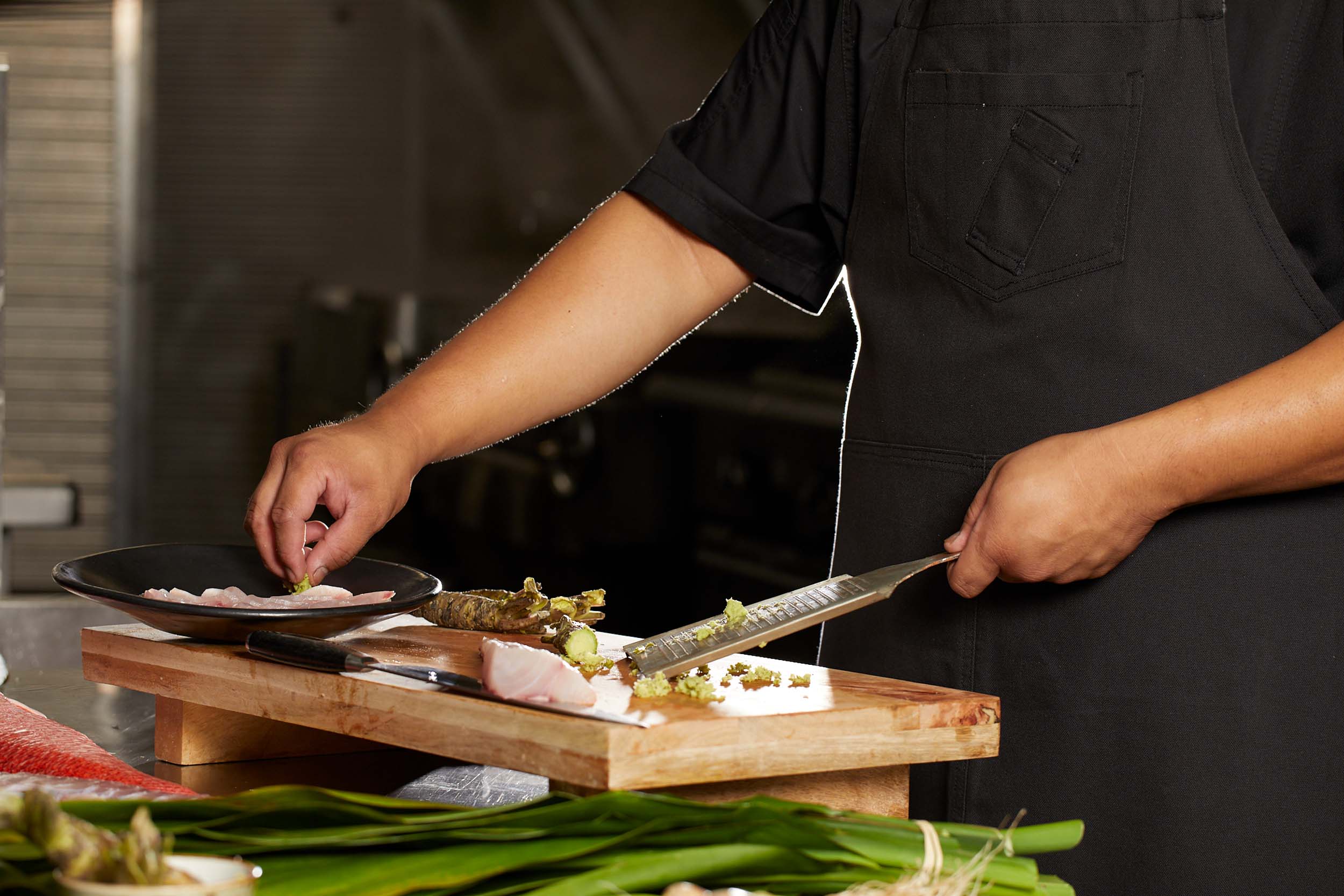 a chef grating wasabi