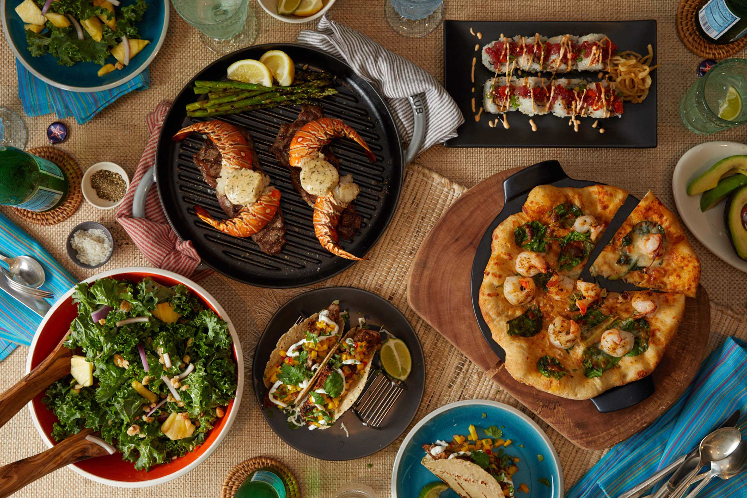 tablescape with tacos, salad, and pizza
