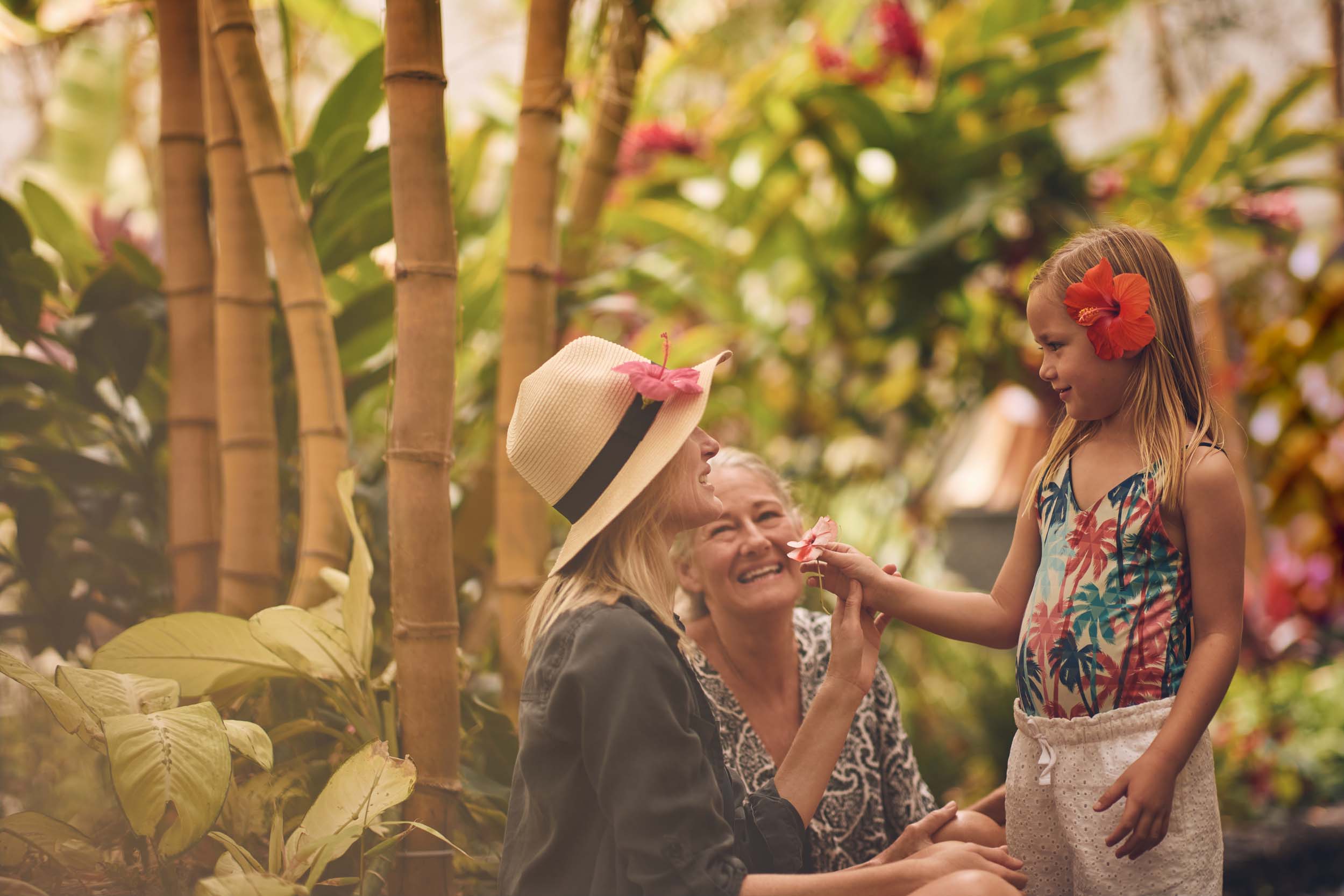 little girl giving her mother a flower