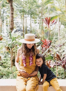 pregnant woman sitting with her child