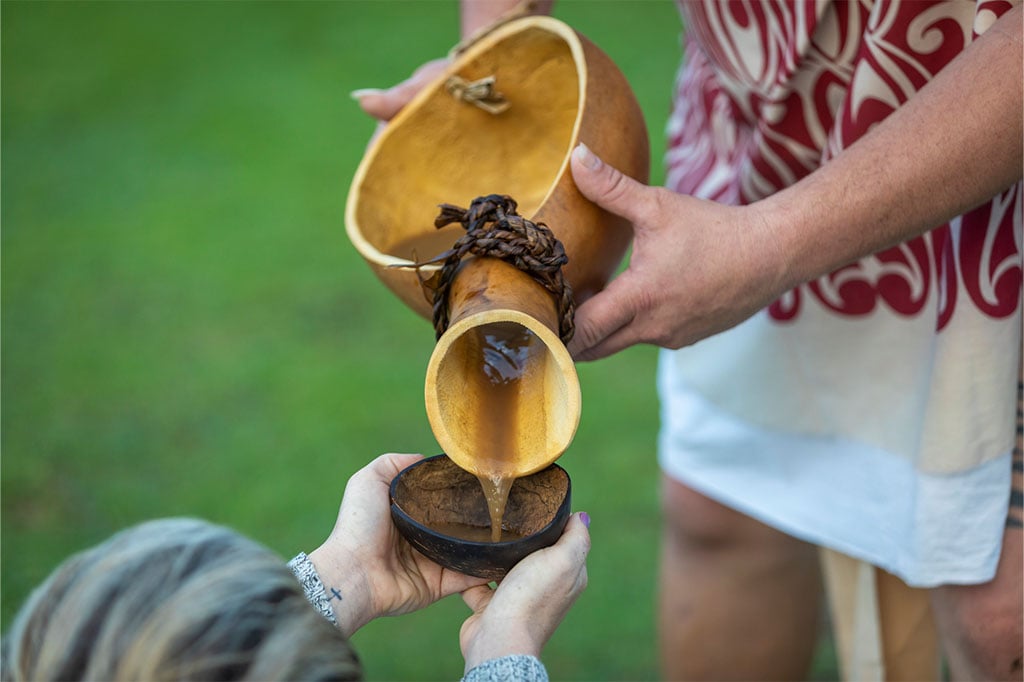 man pouring liquid into a bowl