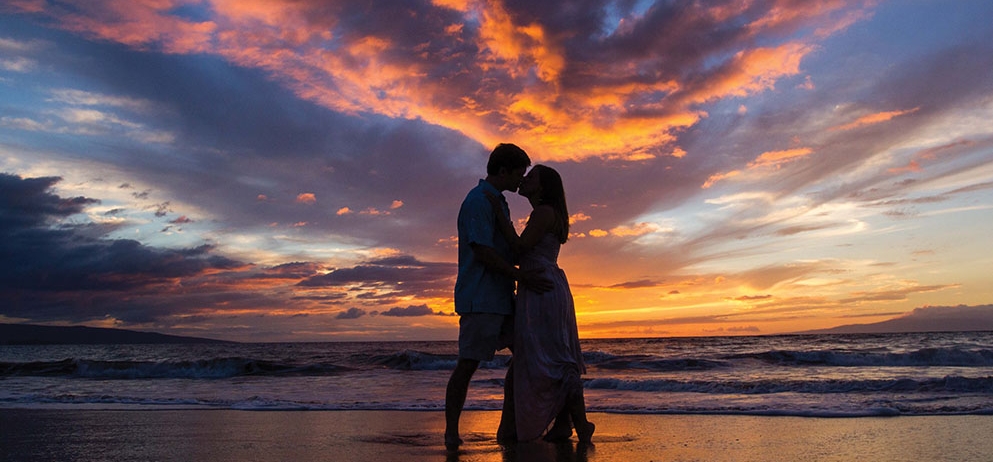 couple kissing on the beach