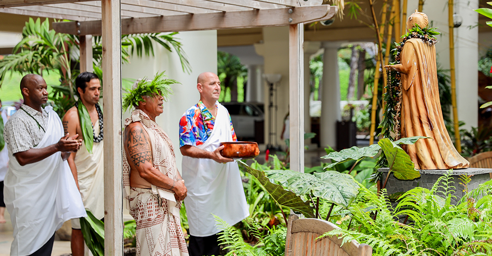 a group of people doing a traditional Pōmaika‘i kūkulu kahua