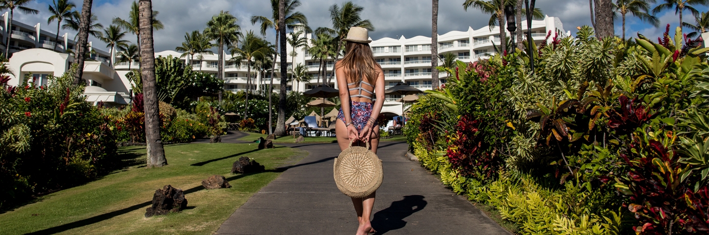 woman holding bag behind her back
